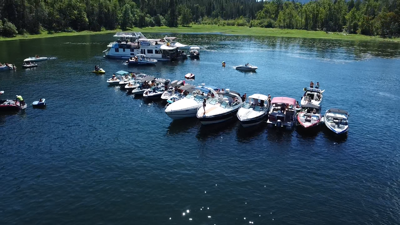 Boats gathered together on Mara Lake during a summer day