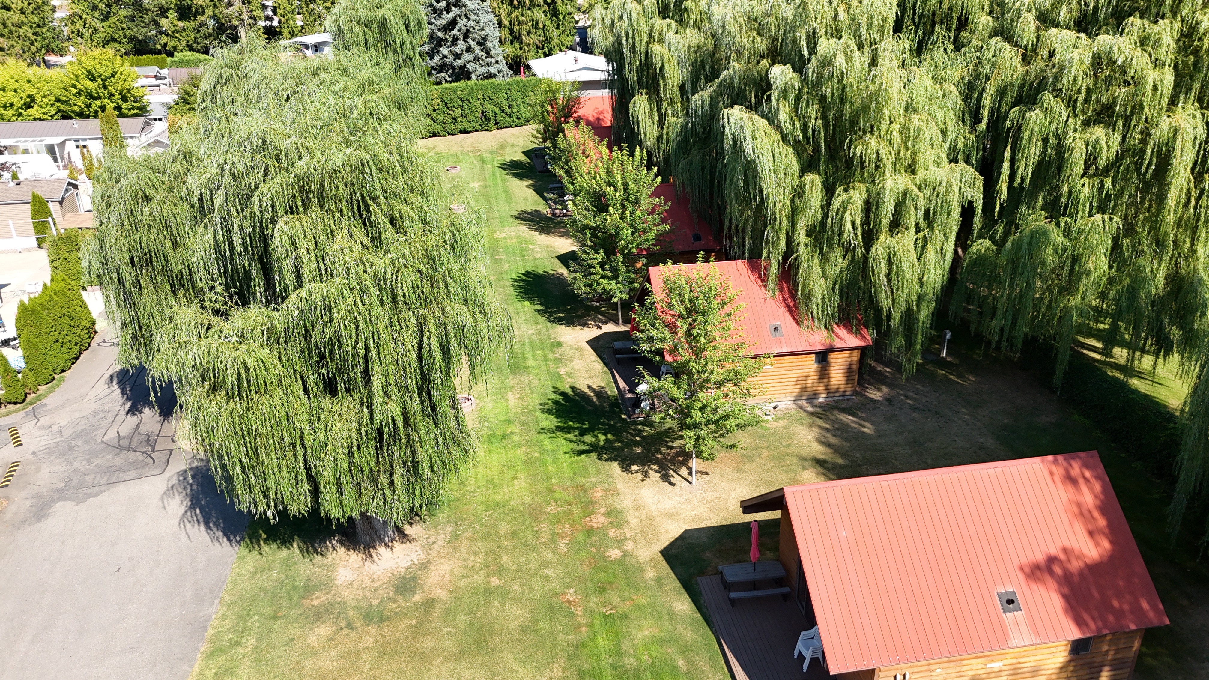 Aerial view of the waterfront cabins and landscaped grounds at Willow Shores Resort